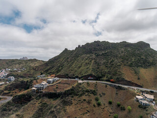 Fototapeta na wymiar Aerial photos of Assomada in Santiago Island, Cabo Verde, reveal the vibrant culture, colorful markets, and stunning mountain landscapes of this historic town. The bird's-eye view captures the essence