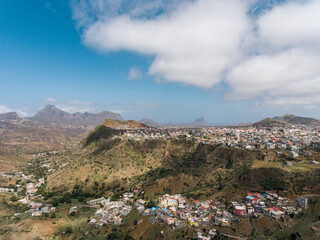 Fototapeta na wymiar Aerial photos of Assomada in Santiago Island, Cabo Verde, reveal the vibrant culture, colorful markets, and stunning mountain landscapes of this historic town. The bird's-eye view captures the essence