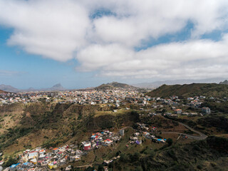 Fototapeta premium Aerial photos of Assomada in Santiago Island, Cabo Verde, reveal the vibrant culture, colorful markets, and stunning mountain landscapes of this historic town. The bird's-eye view captures the essence