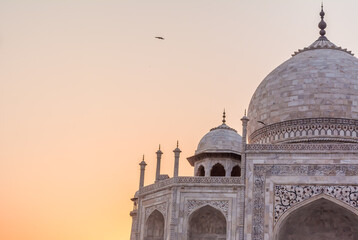 The Taj Mahal is an ivory-white marble mausoleum on the south bank of the Yamuna river in the...