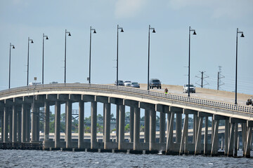 Barron Collier Bridge and Gilchrist Bridge in Florida with moving traffic. Transportation...