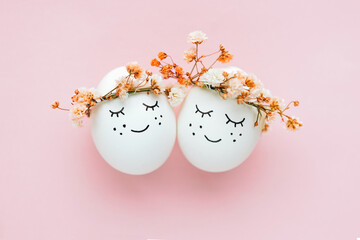 Perfect colorful handmade easter eggs on pink background. The minimal concept. Top view. Card with a copy of the place for the text