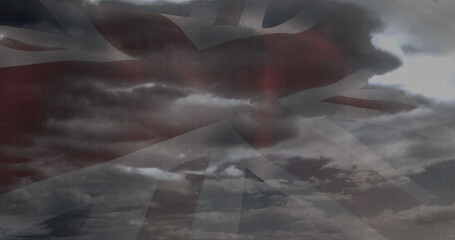 Image of data processing over clouds and flag of uk