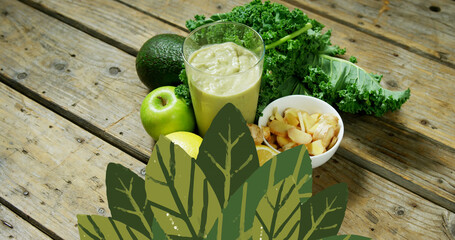 Image of leaf icons over vegetables and healthy drink