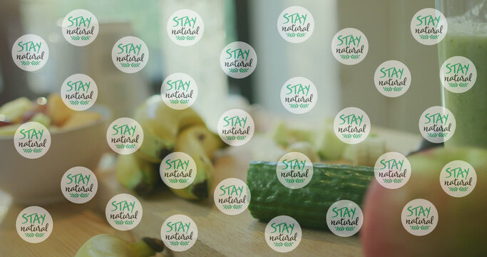 Image of stay natural texts icons over vegetables