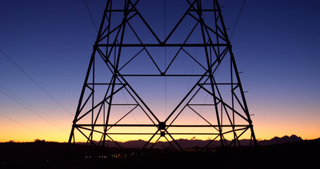 Image of electricity poles at dusk
