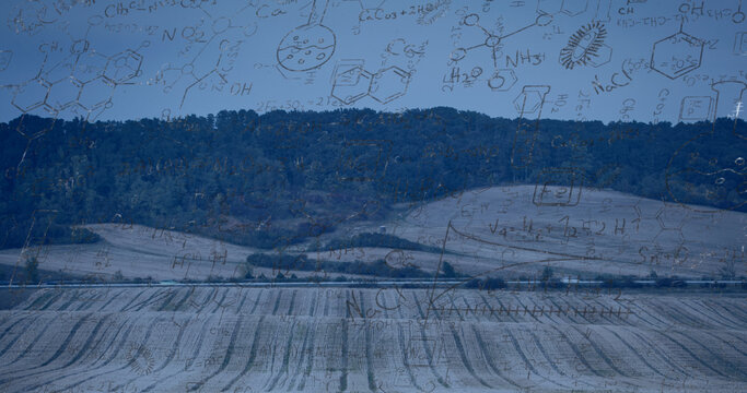 Image of mathematical equations over landscape