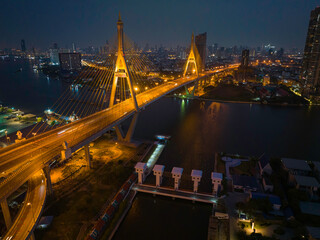 Fototapeta premium Bridge view from the top view of Thailand, Beautiful bridge, and river landscapes bird's eye view during sunset