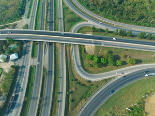 Top view of the road runway through the green Aerial view car truck drivers