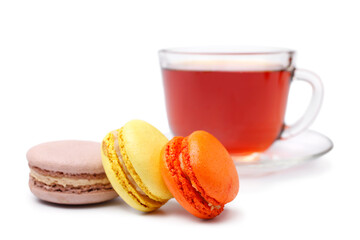 Cup of tea with colorful french macaroons