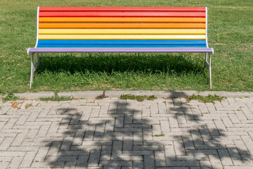 A colorful bench in a public park in the historic center of Bientina, Pisa, Italy