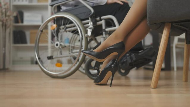 Close-up of man with disability visiting woman psychologist, mental health