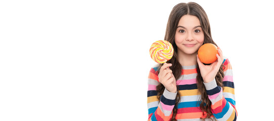 happy teen girl in colorful sweater with orange fruit and lollipop isolated on white, dental care. Child girl portrait with orange, horizontal poster. Banner header with copy space.