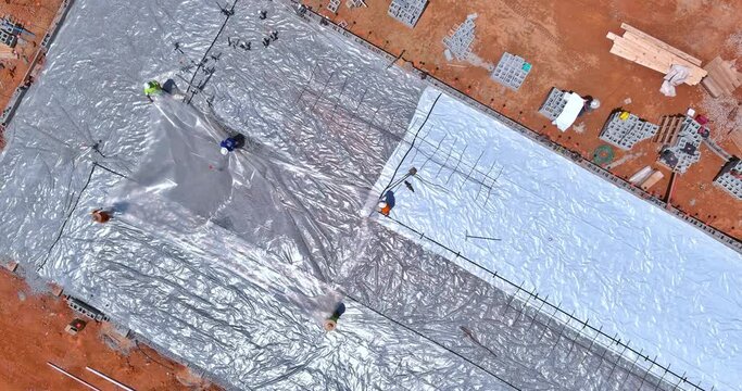 Waterproofing membrane must be laid on top of concrete foundation before it can be poured with concrete
