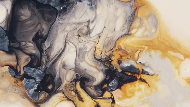 Mixed black, yellow and white paint abstract background. Colorful beautiful liquid flow with swirls and waves. Blending marbling trendy texture