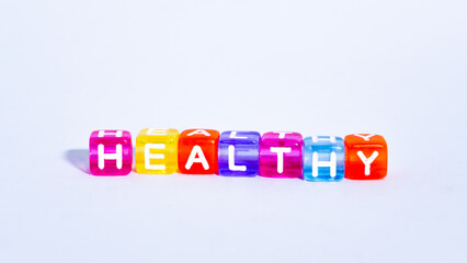 colorful blocks form the word "healthy". fun concept of healthiness