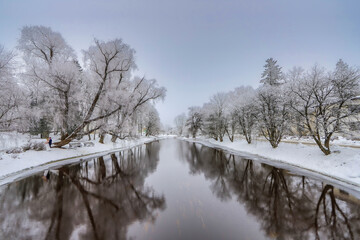 River promenade and snowy trees