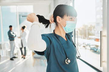 Covid, window and doctor at a hospital for healthcare, medical work and thinking. Idea, hair care and nurse wearing a face mask for a virus while working at a clinic, looking at view and medicare