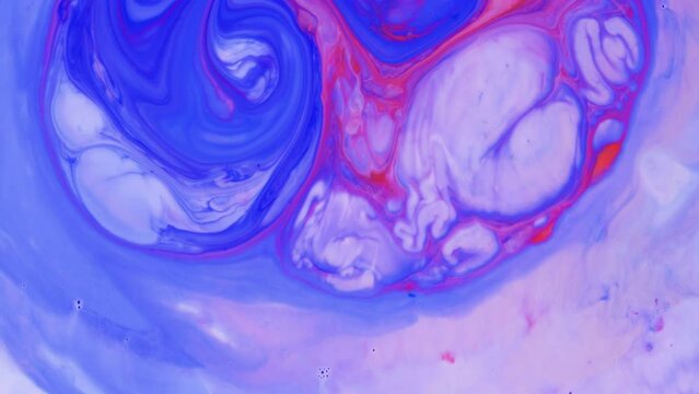 Light violet acrylic paint shades mixing abstract background. Pink and blue dye swirls in white milk creative texture. Blending liquid flow colorful fantasy backdrop