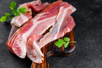 bacon strips slice smoked lard meat meal food snack on the table copy space food background rustic...