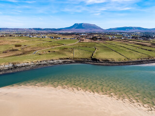 Aerial view of Ballyness Bay and Magheraroarty with the Muckish in the background in County Donegal - Ireland © Lukassek