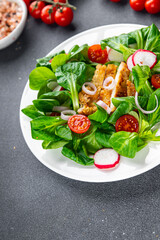 fresh salad chicken meat, vegetable, tomato, radish, green leaves mix lettuce meal food snack on the table copy space food background rustic top view 