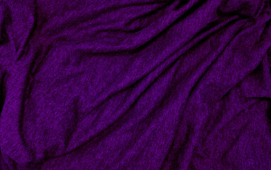 Fototapeta na wymiar close up ripple purple fabric cloth background texture. crumpled elegant violet fabric background and texture. abstract sensual background, empty template with selective focus.