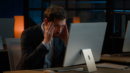 Exhausted Caucasian businessman adult man work overtime in office late night tired entrepreneur...