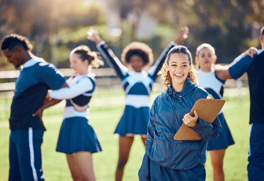 Cheerleader team, woman portrait and training coach with clipboard for practice, sports management and competition. Happy black woman or cheerleading checklist for coaching group of people outdoor