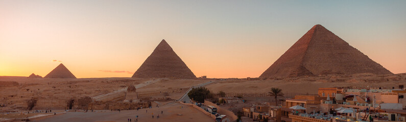 Fototapeta na wymiar Panorama View of The Great Pyramids of Giza at Sunset