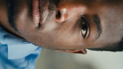 Vertical view close-up half part face African American ethnicity man adult businessman 30s entrepreneur manager lawyer banker professional agent male office worker confident business portrait indoors