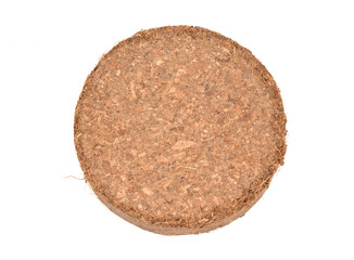 Coconut Coir substrate. Pressed briquette Isolated on White Background