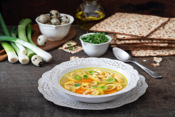 Vegetable broth with egg pancakes and matzo bread. Pesah celebration concept (jewish Passover holiday)