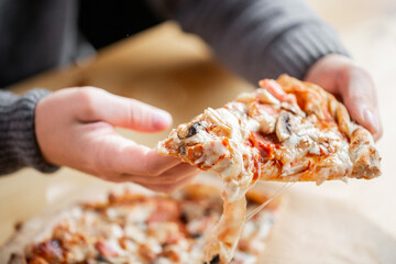 one people taking slices of pizza out of the box. fast delivery of food. packaging for fast food. top view