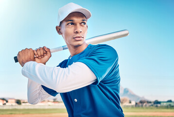 Sports, baseball and serious man with bat on field ready to hit ball in game, practice and competition. Fitness, motivation and male athlete outdoors for exercise, training and workout for match