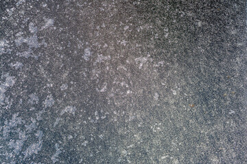 Winter frost background on a frozen window panel showing wintertime ice texture, stock photo image