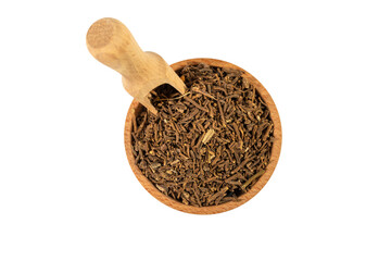 Valerian herb root in wooden bowl and scoop isolated on white background. Valeriana officinalis....