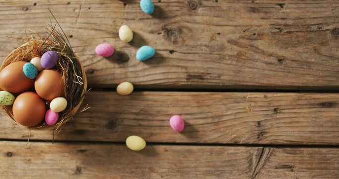 Video of decorated colorful easter eggs on a wooden surface