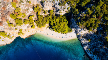 Get lost in the picturesque scene of Croatia's beach, with its stunning turquoise waters and pristine coastline. From above, the aerial view showcases the perfect spot for a vacation and adventure.