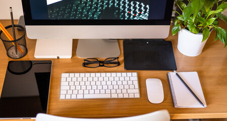 Modern Personal Computer, Keyboard, Tablet, Graphic Tablet And Office Accessories On The Desktop In...