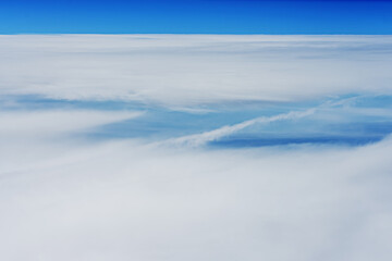 Fototapeta na wymiar A large amount of clouds covering a wide area seen from 10,000 feet