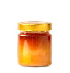Fresh honey in a jar on a white isolated background.