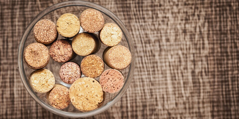Top view wine corks in a glass goblet.