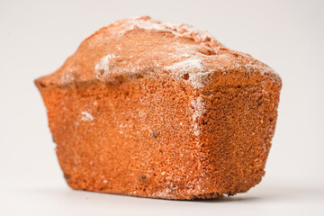 A cupcake with raisins isoalted on a white background.