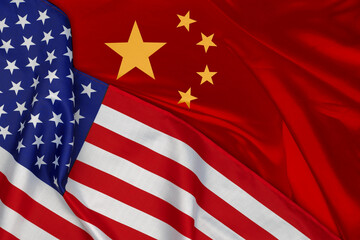 American and Chinese flags together. Background for political and economic concepts. National symbols of North America and Asia.