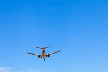 Fototapeta na wymiar Big passenger plane in the blue sky