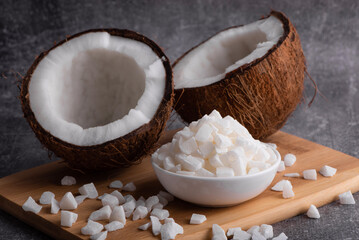 Whole coconut. Coconut shavings and coconut pieces. Fresh coconut.