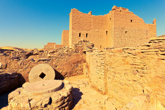 Millstone with Coptic crosses in half ruined Monastery of St. Simeon in Aswan - fortress-like 7th-century  Christian monastery, the largest ancient Coptic architecture complex in Egypt