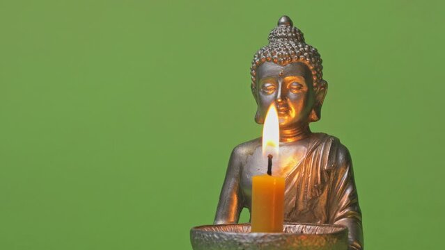 Candle holder with Buddha image