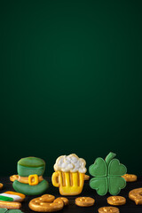 Vertical Saint Patricks day background with gold horseshoe and four leaf clovers on a dark...